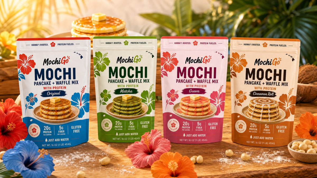 All four MochiGo flavors — Original, Guava, Matcha, and Cinnamon Roll — on a tropical wooden table.