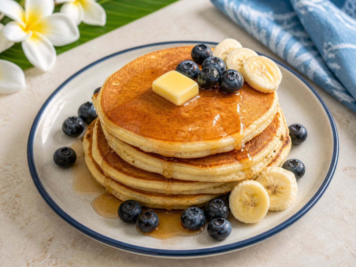 Original mochi pancakes with butter, syrup, blueberries, and banana.